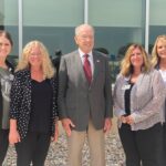 Jackie Blackwell, Chief Quality Officer; Michelle Andersen, Chief Nursing Officer, Shelli Lorenzen, Chief HR Officer, and Linn Block, CEO, pose with Senator Grassley outside of MRHC.